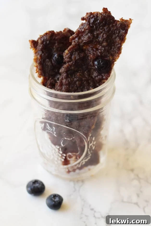 A class jar filled with beef jerky.