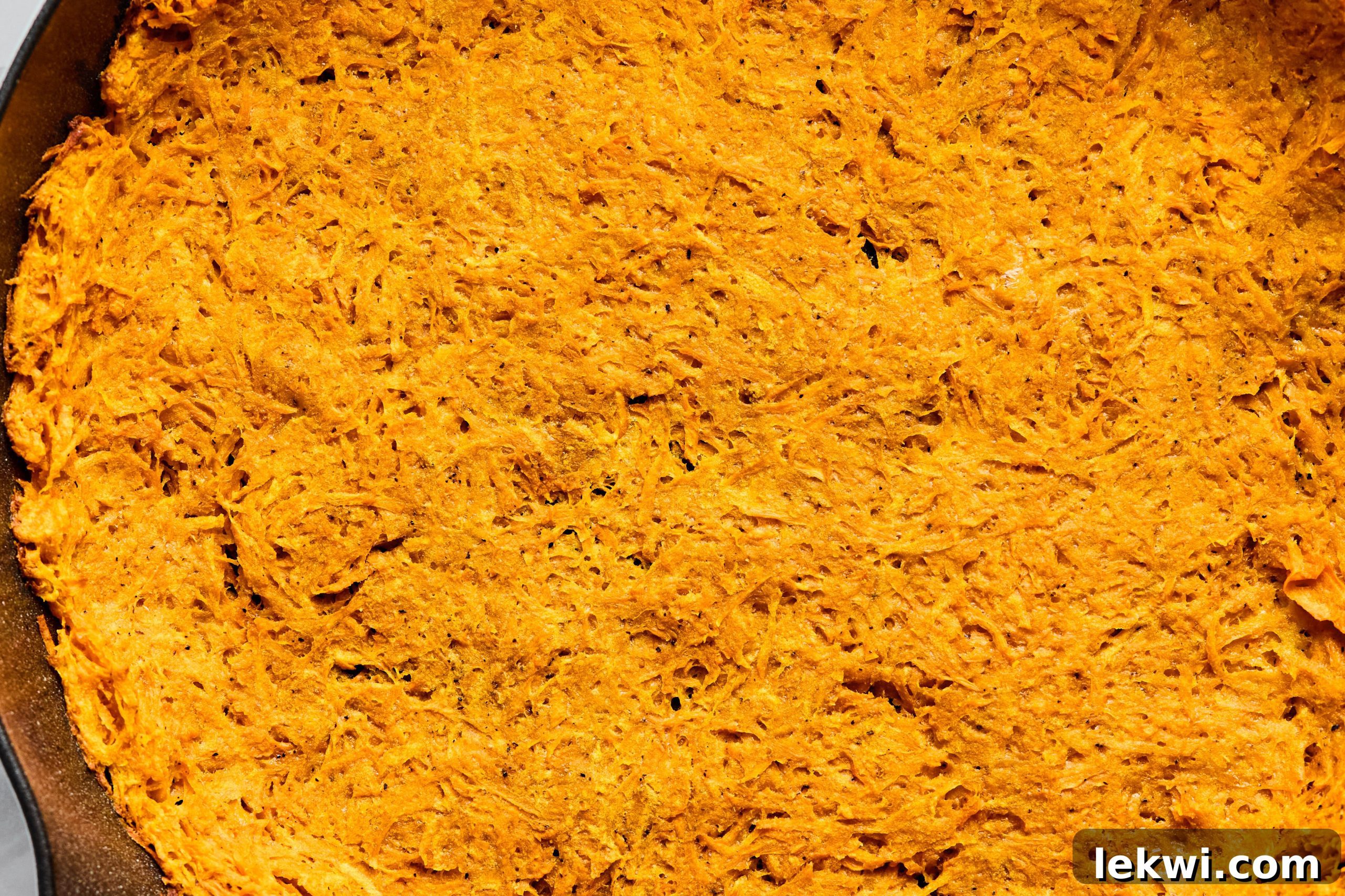 The sweet potato crust after pre-baking, golden brown at the edges.