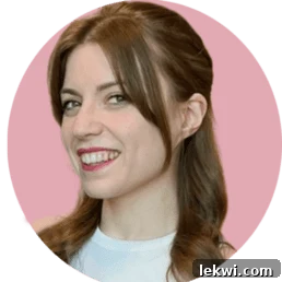 Food blogger Michelle Hoover smiling brightly against a soft pink background.