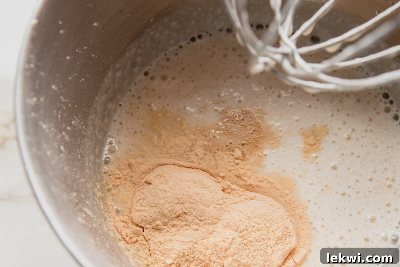 The marshmallow layer ingredients in a pot before mixing and whipping, showing almond milk, gelatin, and cane sugar.