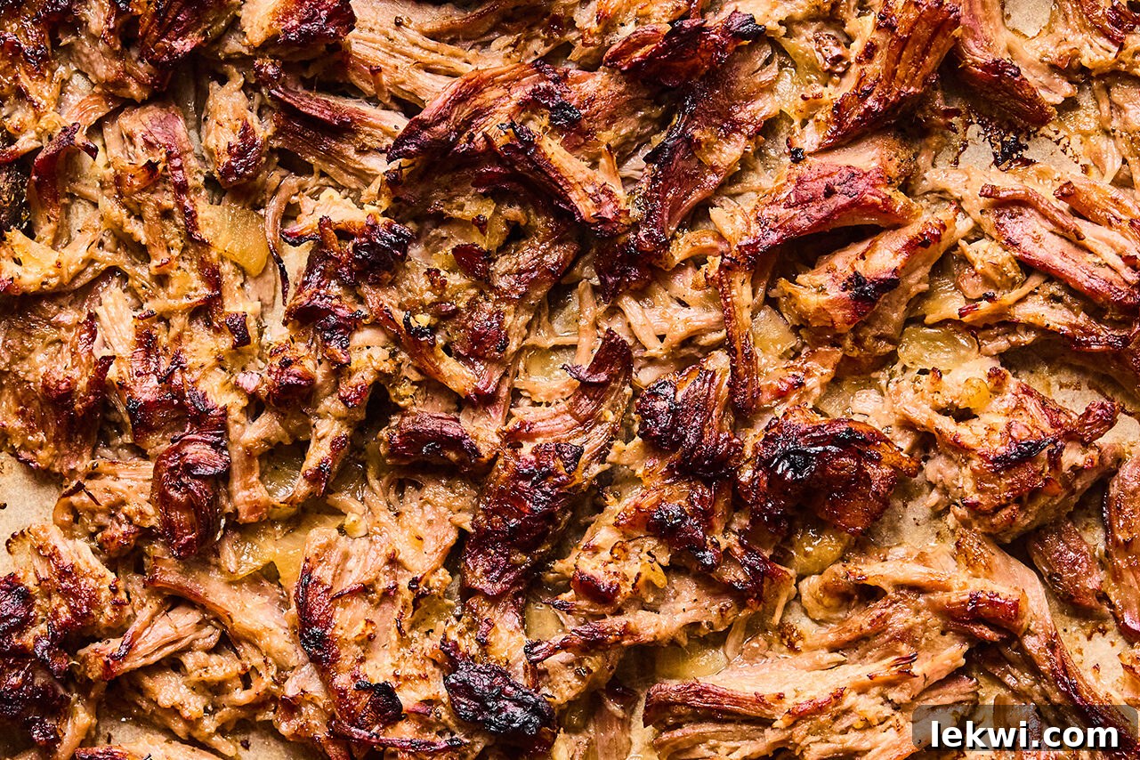 Crispy carnitas on a baking sheet. 