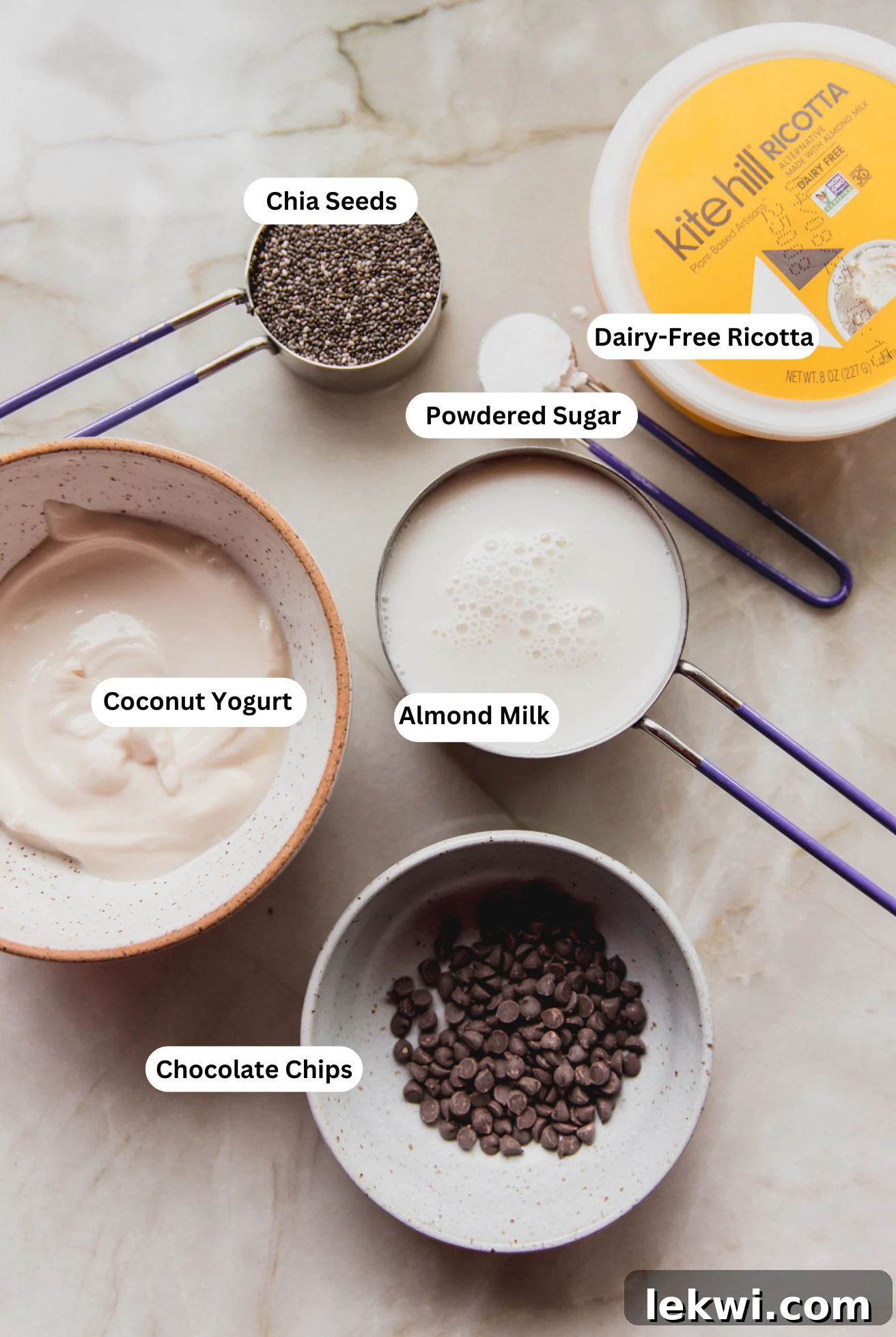 All the ingredients neatly arranged on a counter, ready to be combined for making the cannoli chia seed pudding.