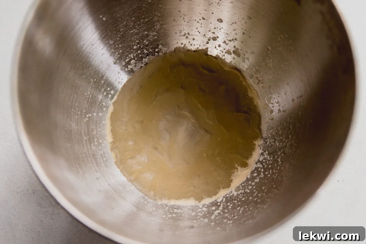 Gelatin and water in a stand mixer.