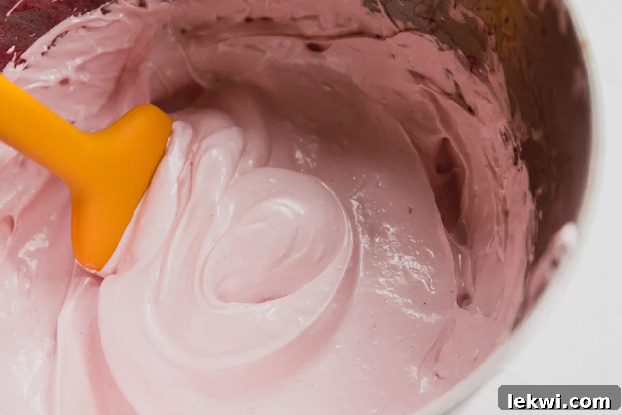 The strawberry marshmallow fluff after beating and adding the strawberries and beet powder.