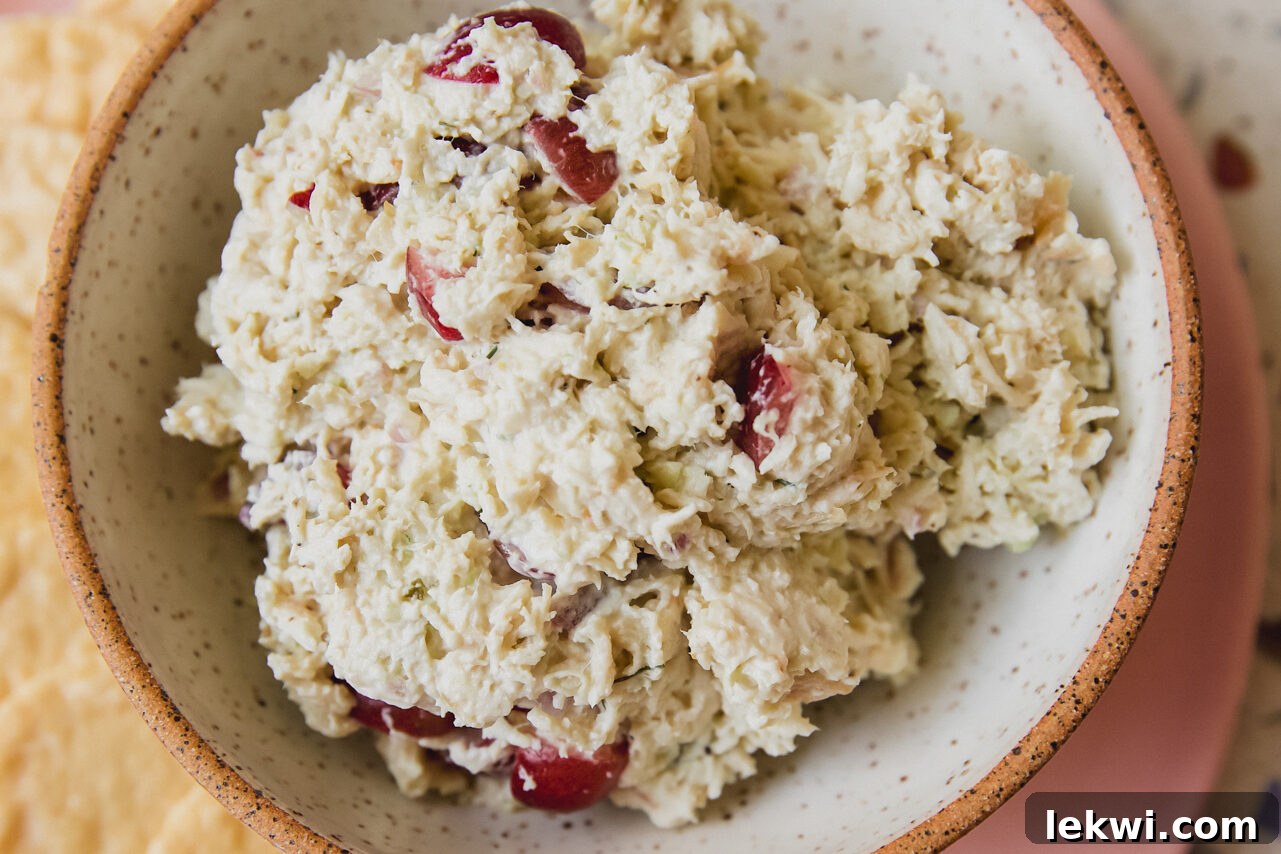 The fully mixed, creamy grape chicken salad in a serving bowl, ready to be enjoyed.