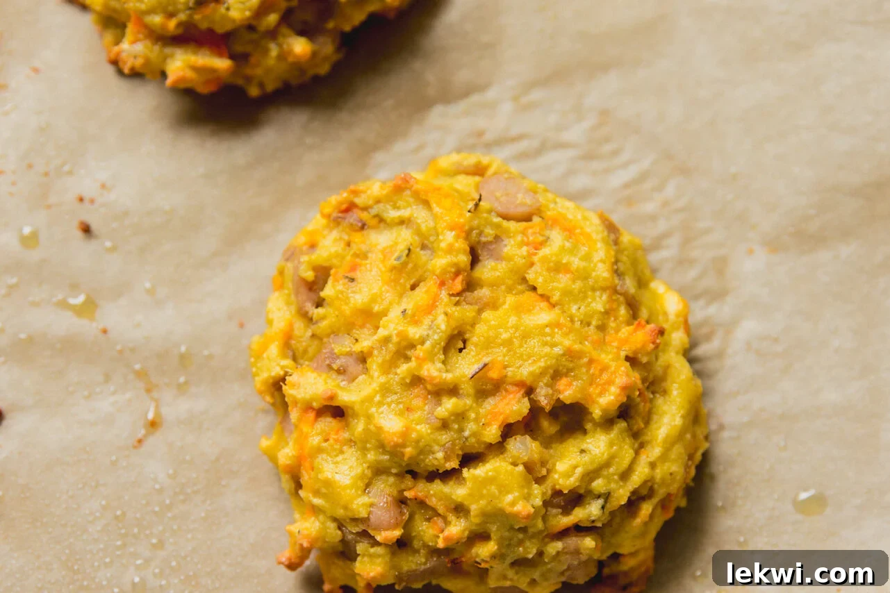 A cooked protein breakfast biscuit on a baking sheet.