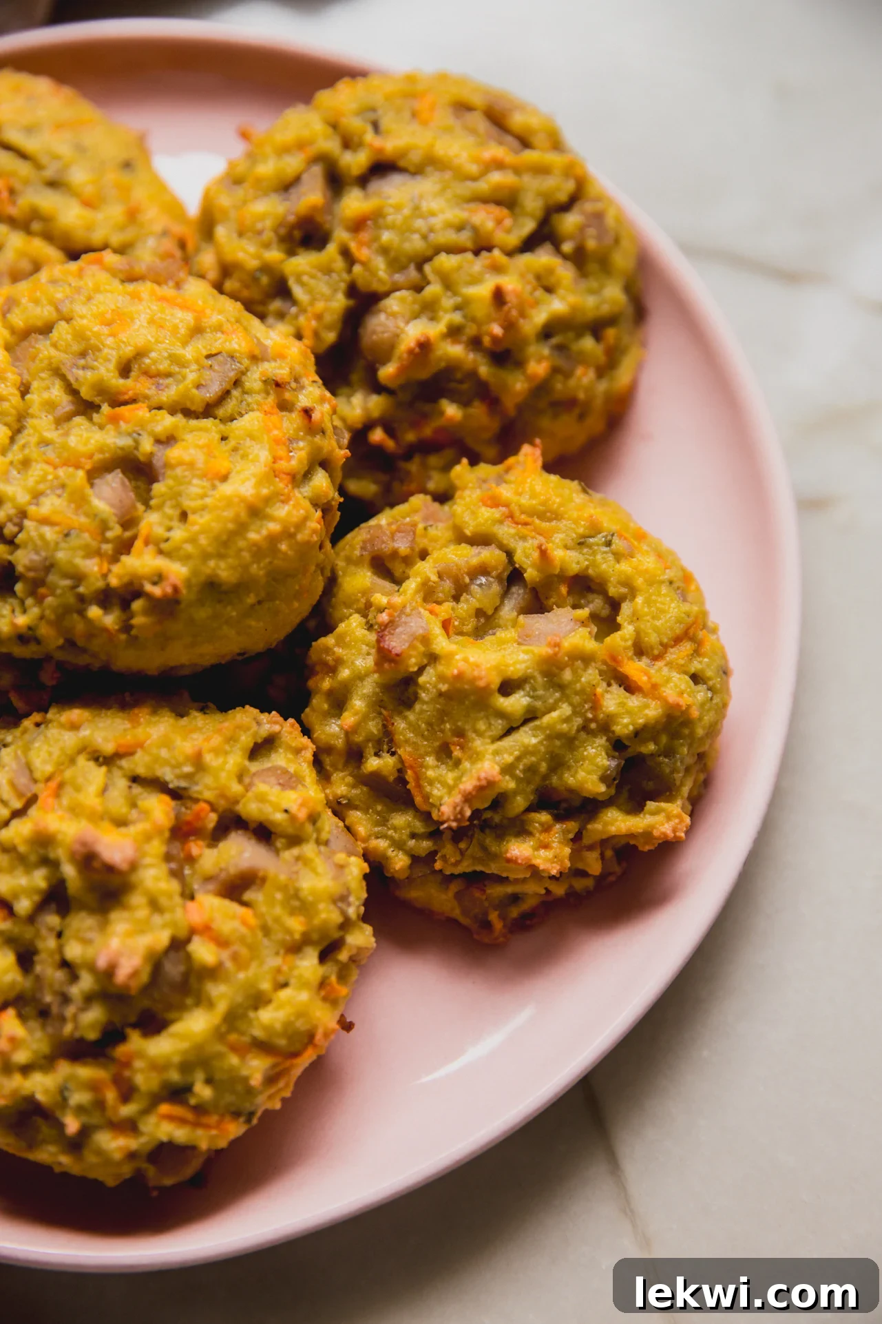 Protein breakfast biscuits on a pink plate. 