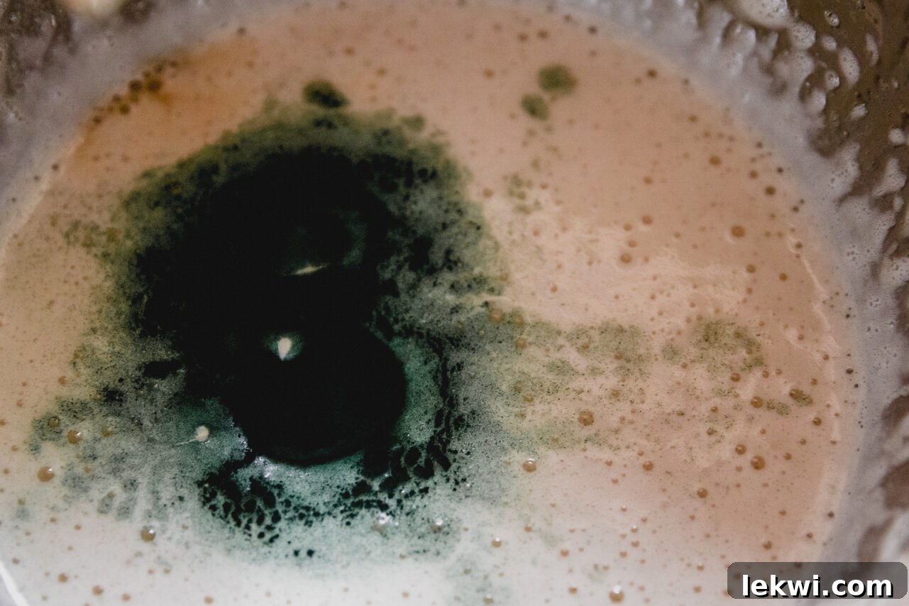 The mixture to make the green layer in the metal bowl.