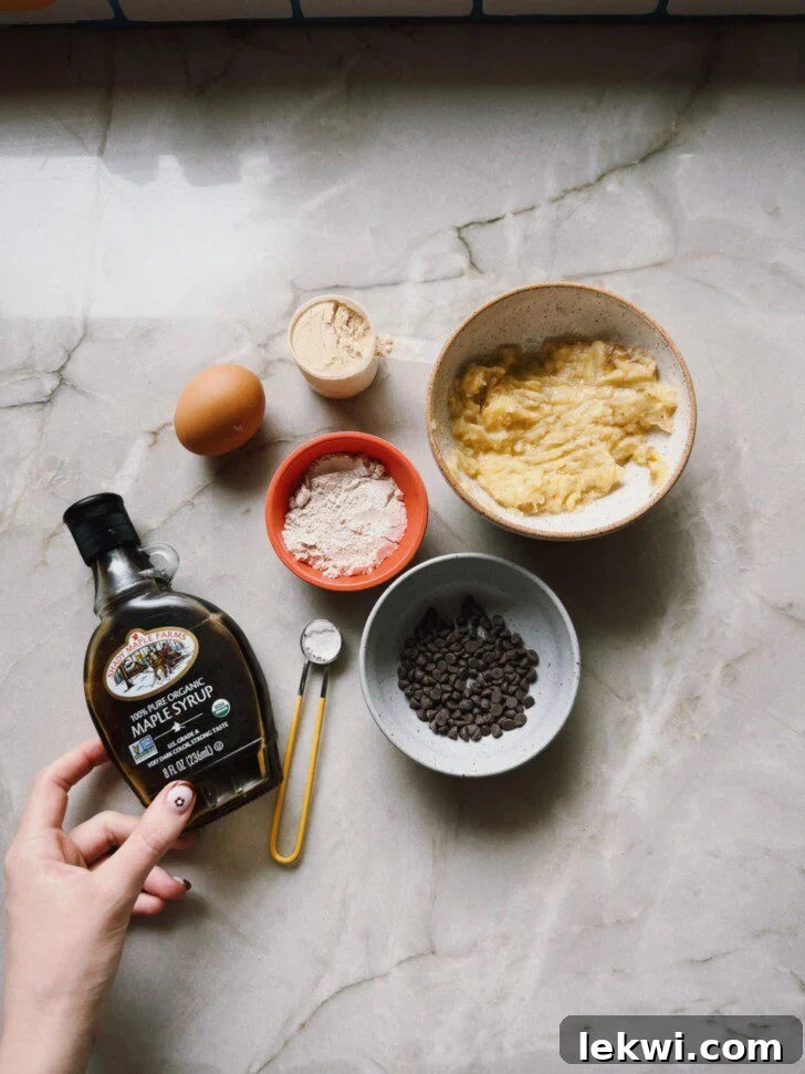 A vibrant display of all the individual ingredients for the banana breakfast cake, neatly arranged on a counter.