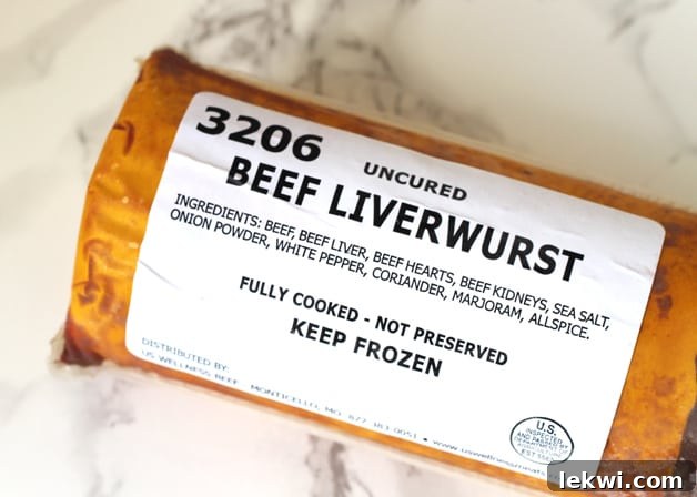 A container of uncured beef liverwurst sitting on a counter.
