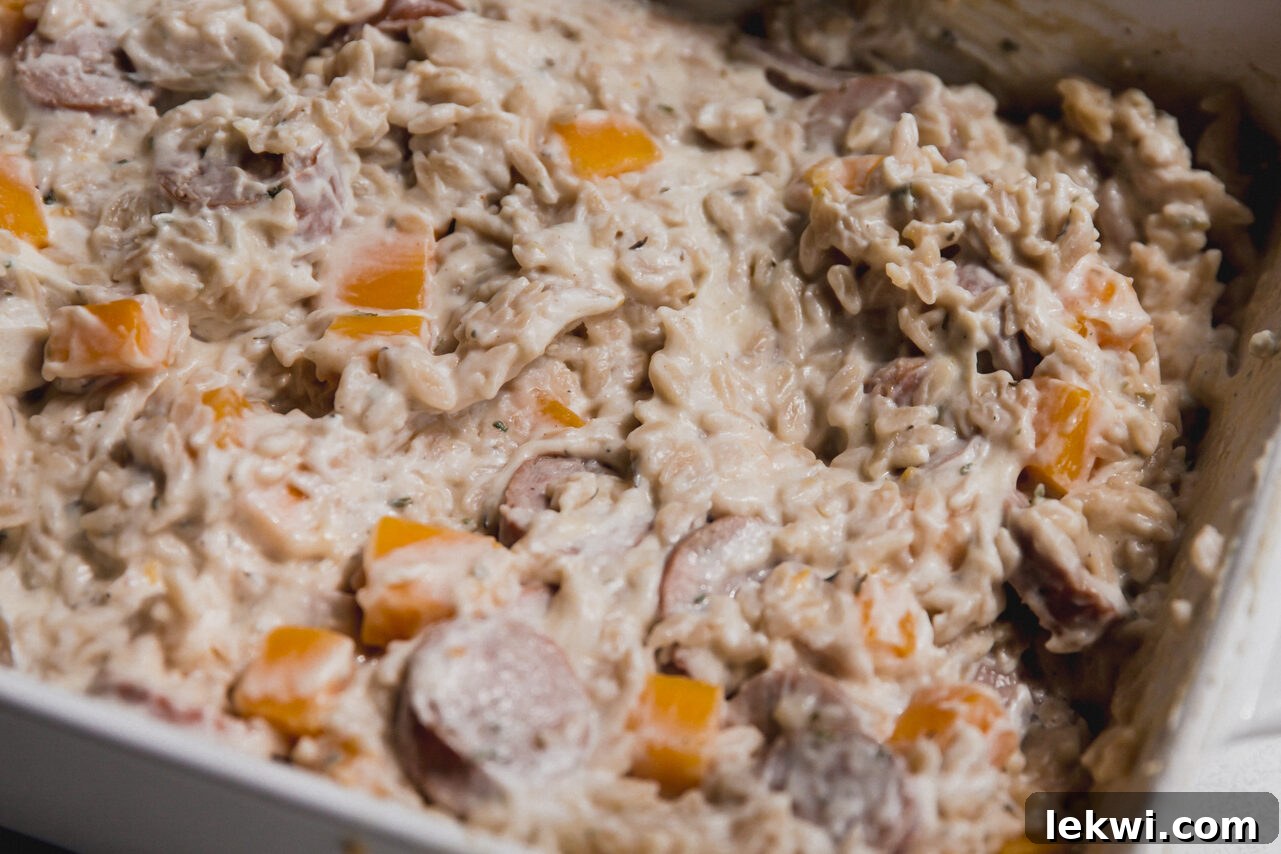 The finished one pan chicken sausage and orzo bake, mixed and ready to be eaten.
