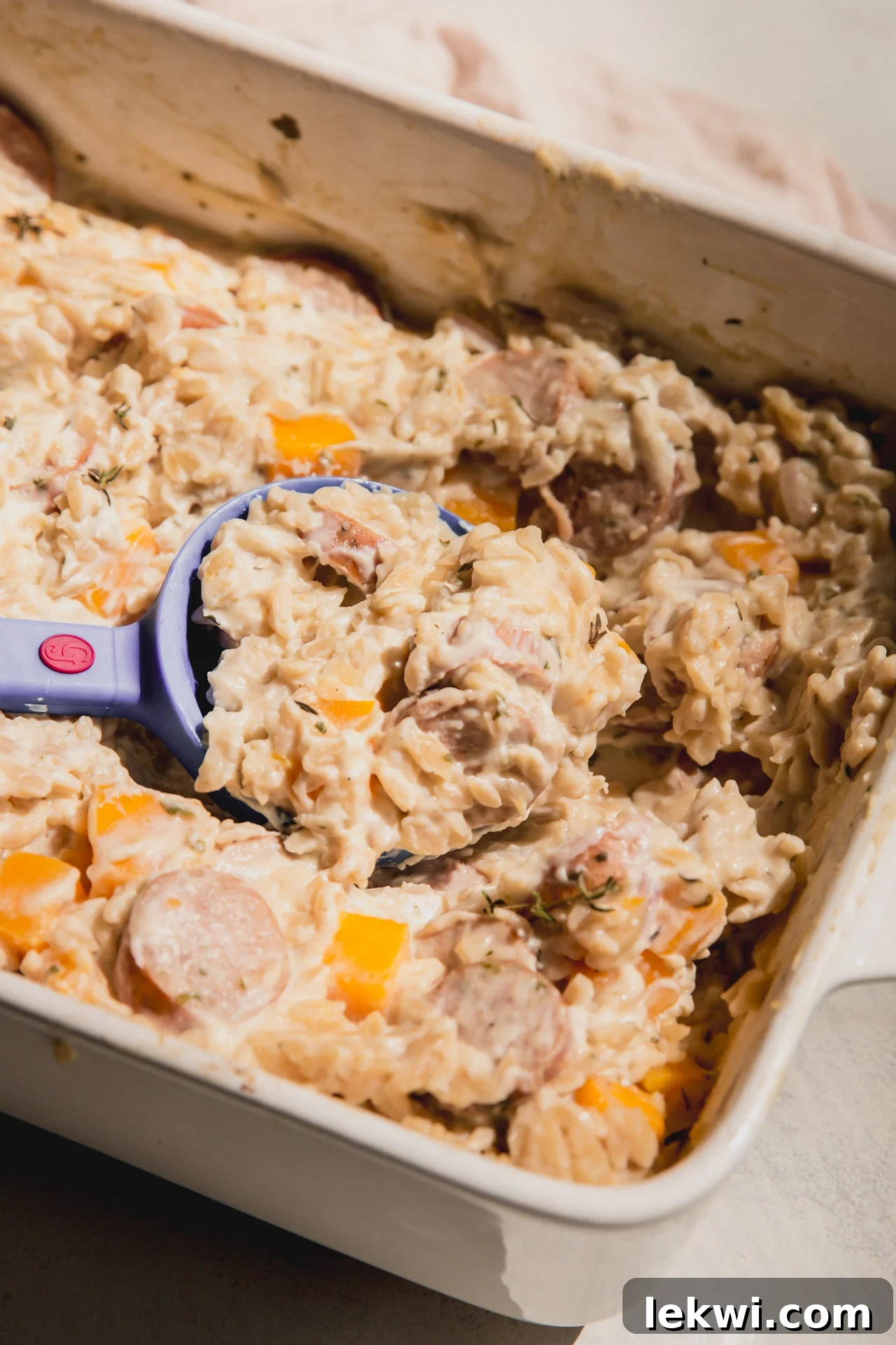One pan chicken sausage and orzo in a casserole dish.