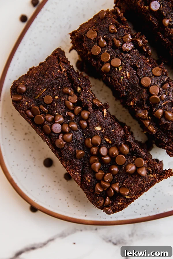 Slices of chocolate zucchini bread on a plate.