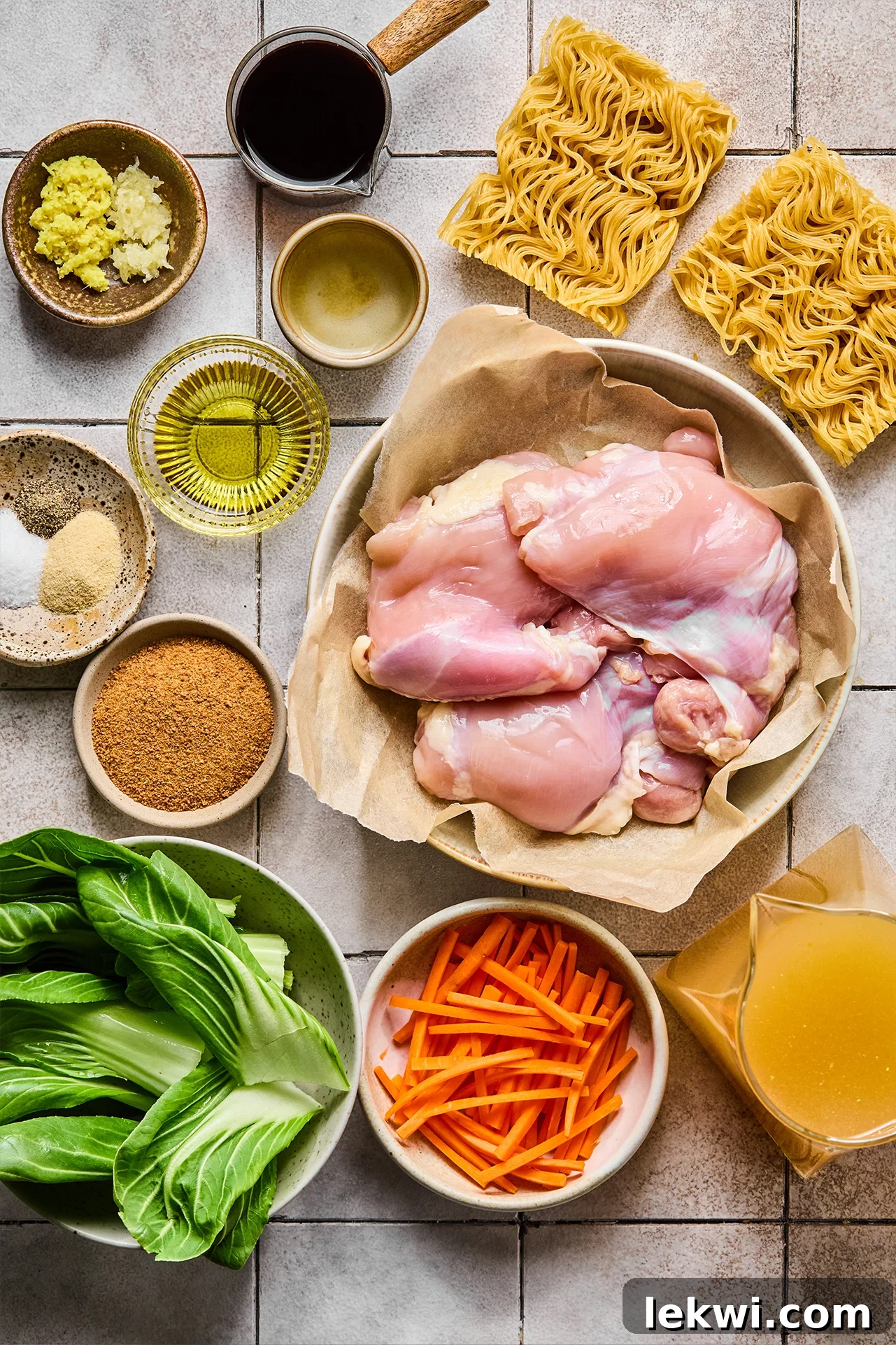 All the fresh ingredients for homemade Chicken Teriyaki Ramen, neatly laid out on a kitchen counter, ready for preparation.