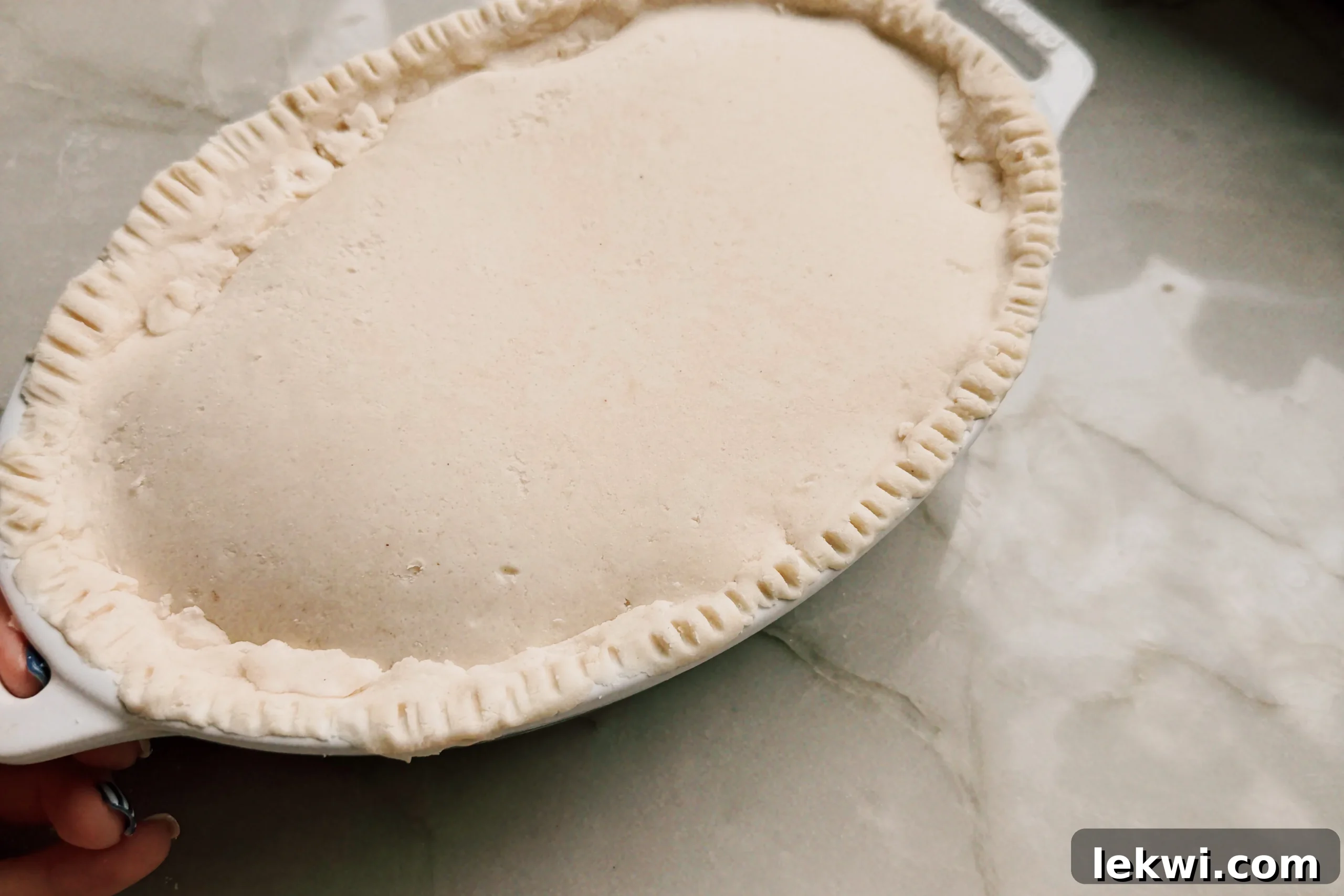Comforting Gluten-Free Beef Pot Pie 7 The beef pot pie, covered with a crimped cassava flour crust, ready for chilling.