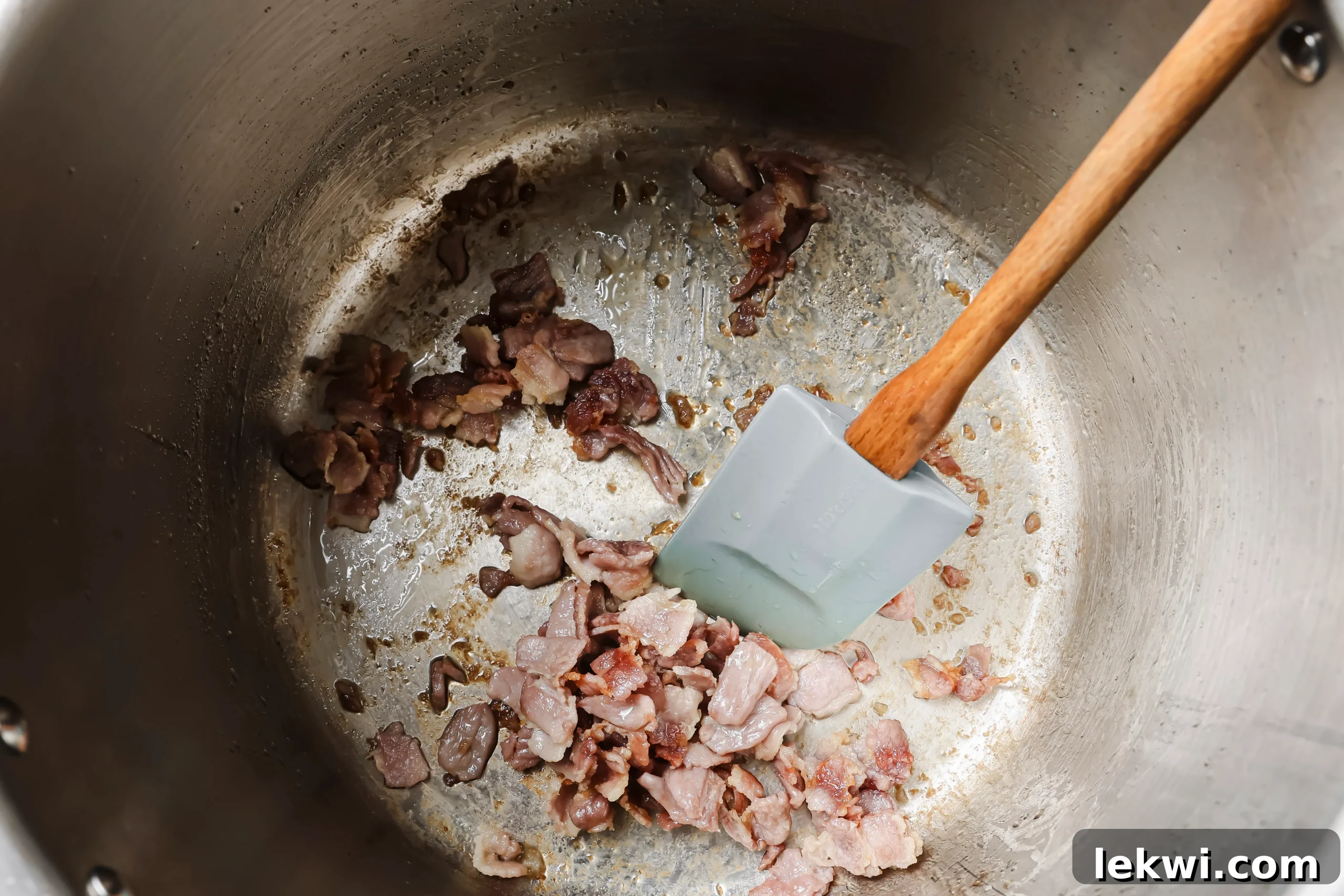 Bacon sizzling and crisping in the Instant Pot on sauté mode.
