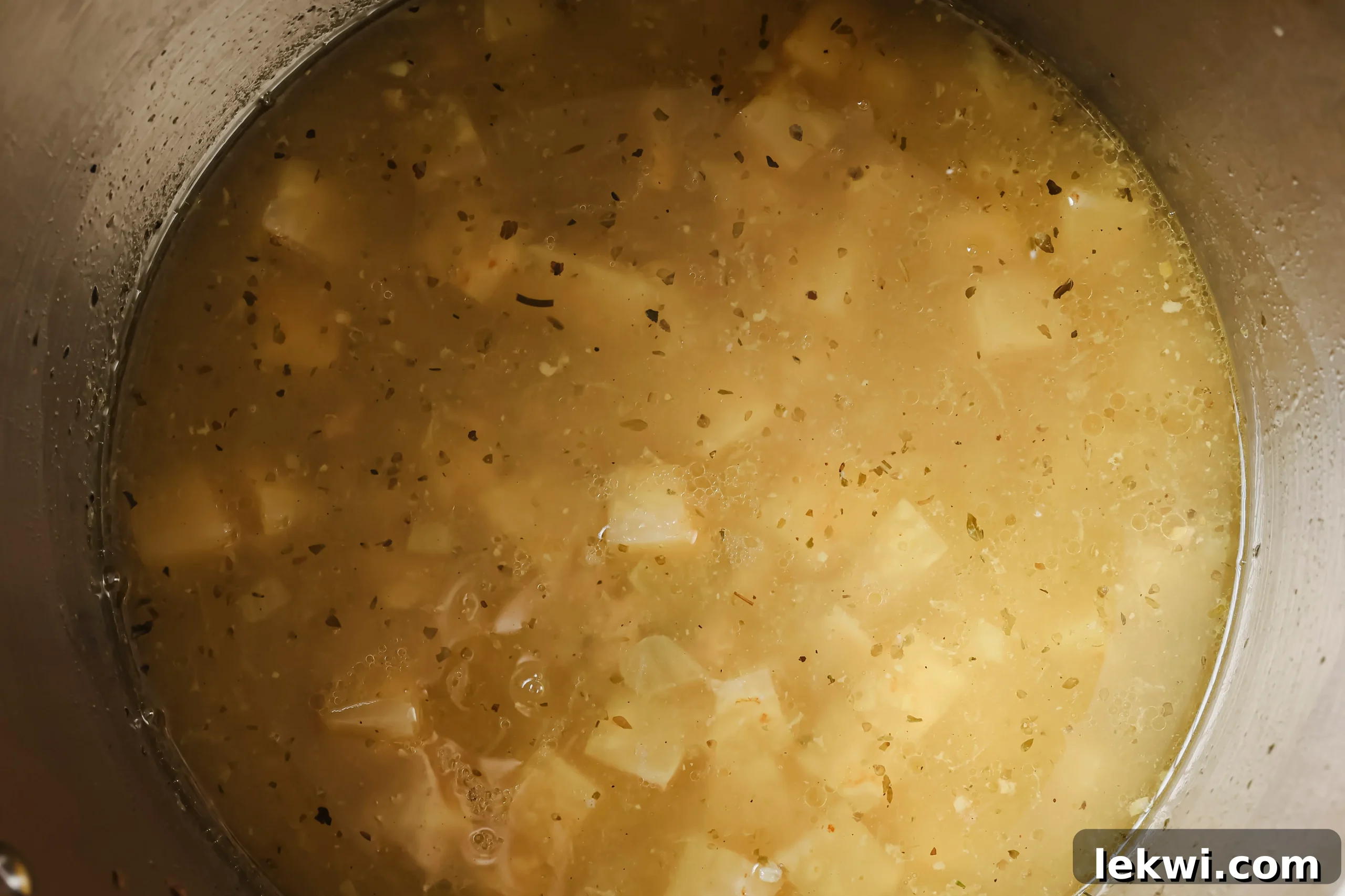 The Instant Pot filled with all soup ingredients before the lid is locked for pressure cooking.