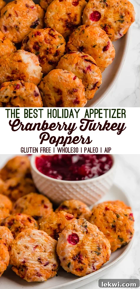 Cranberry Turkey Poppers arranged on a rustic wooden board, garnished with fresh rosemary, suitable for a holiday Pinterest pin or festive serving.