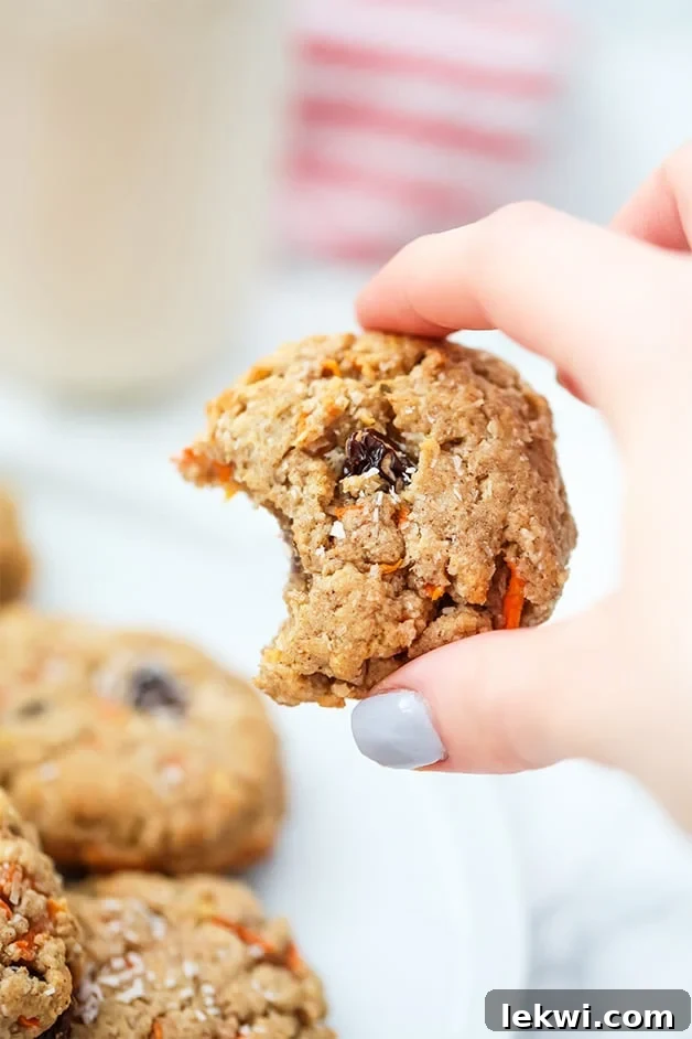 Close-up of a stack of Paleo Carrot Cake Protein Cookies, showing their soft and chewy texture.