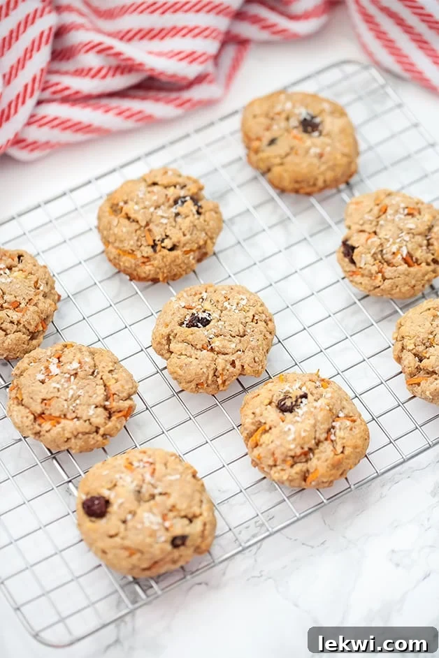 A large stack of vibrant Paleo Carrot Cake Protein Cookies, ready to be enjoyed as a wholesome, nourishing snack.
