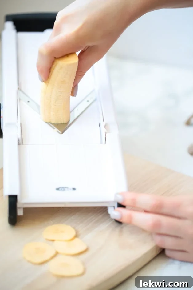 Crispy baked plantain chips artfully arranged on a serving plate, ready to be enjoyed.