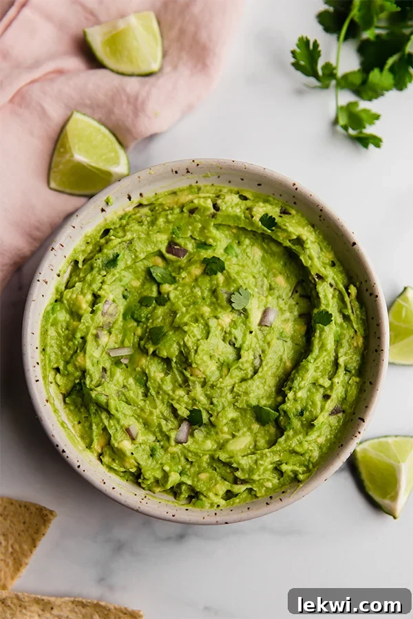 A vibrant bowl of freshly made AIP Guacamole, ready to be served.