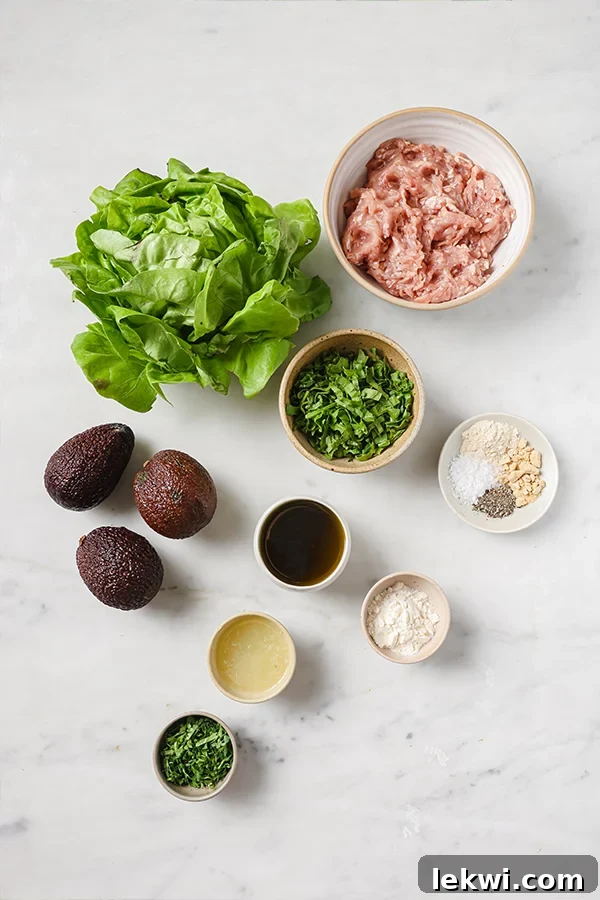 A vibrant collage of fresh ingredients laid out for Spinach Avocado Chicken Burgers, including creamy avocados, a bowl of white coconut flour, and bright green limes, all essential for the recipe.