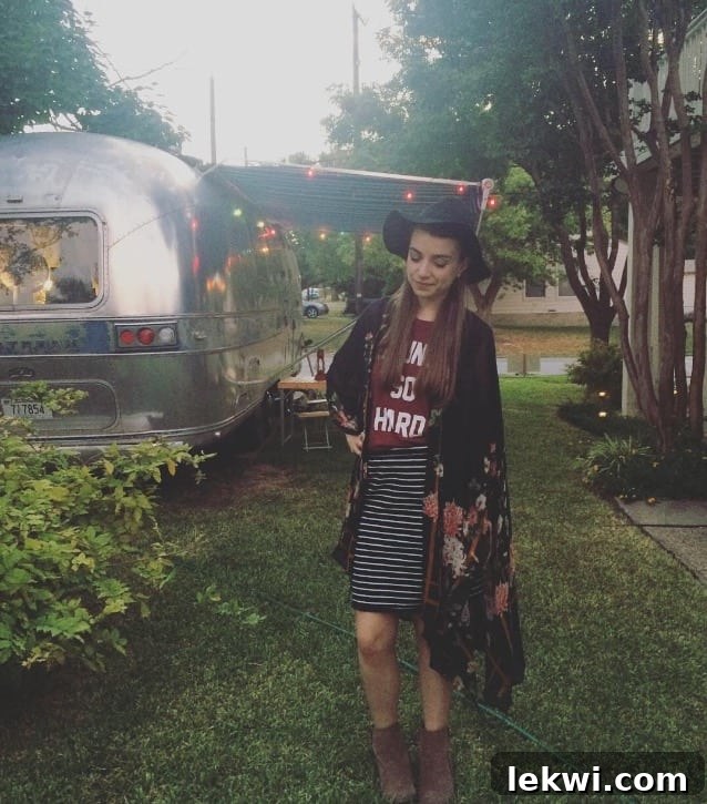 The author, dressed up for the house concert, posing with a warm smile, showing off her rejuvenated look after a day of rest.