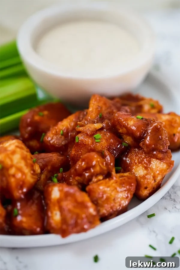 Crispy BBQ Chicken Poppers ready to be served on a white plate