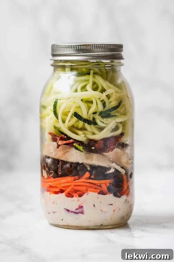 Mason Jar BLT Salad with bacon, ranch dressing, chicken, and greens