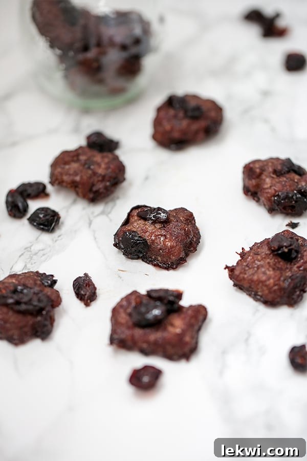 Assortment of cranberry beef jerky bites on a board, showcasing their appealing texture and snackability
