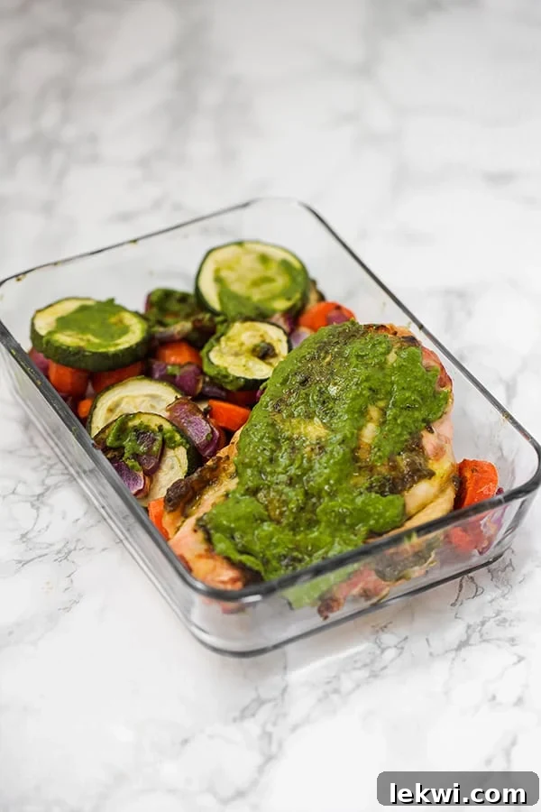 One-pan chicken pesto with roasted vegetables for a meal prep friendly paleo lunch.