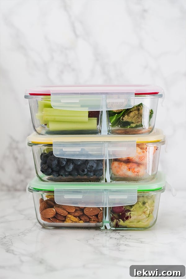 Assortment of meal prep lunches in glass containers, ready for the week.