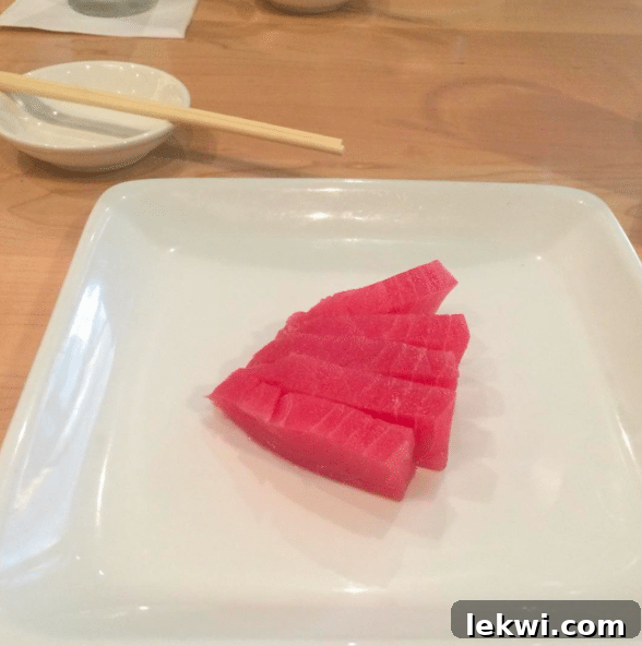 A plate of fresh tuna sashimi, carefully chosen to accommodate dietary restrictions at a sushi lunch.