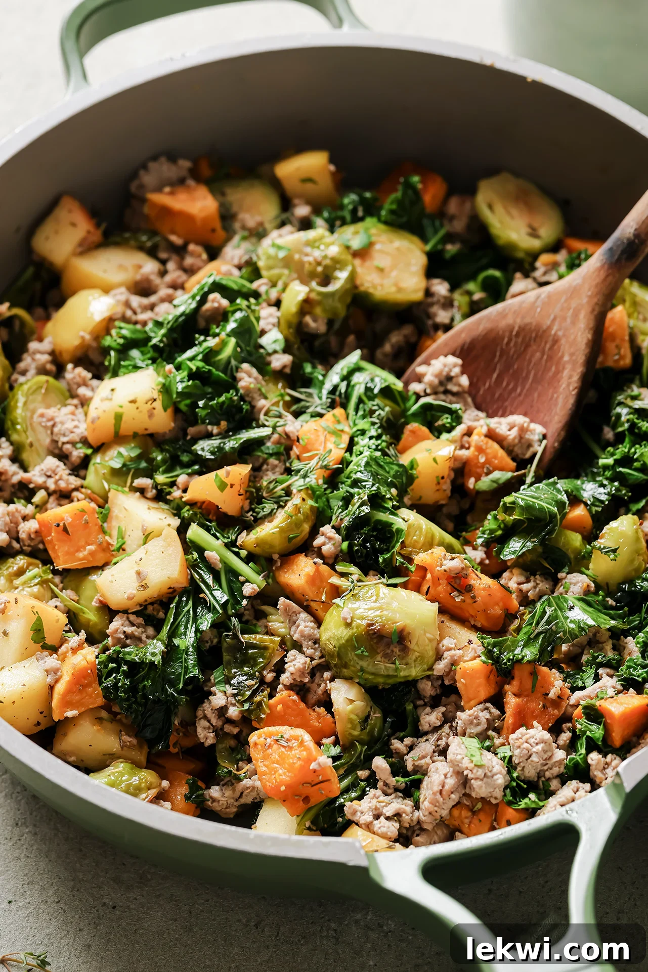 Turkey and veggie hash in a skillet, ready to be served for a hearty breakfast.