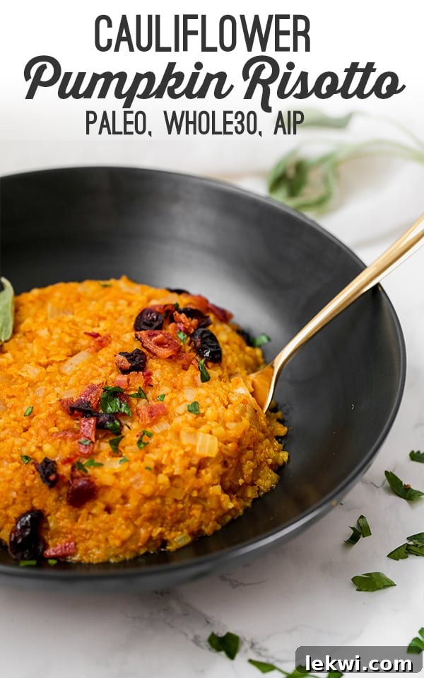 A beautifully plated cauliflower pumpkin risotto garnished with fresh herbs and crispy bacon bits, showcasing its autumnal appeal and rich, creamy texture.