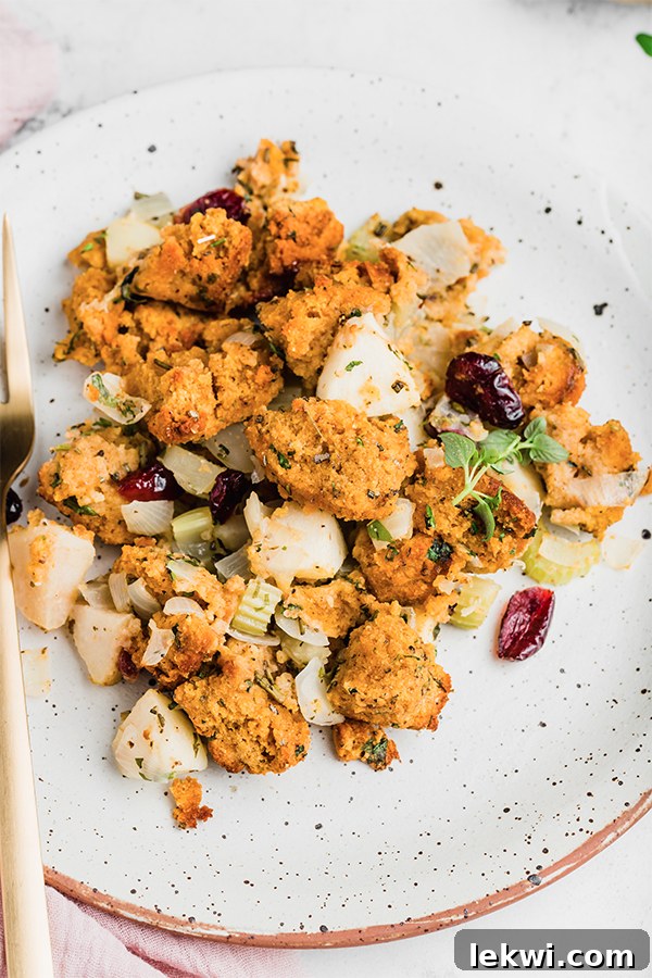 A plate of golden brown paleo cornbread stuffing, ready to be enjoyed.