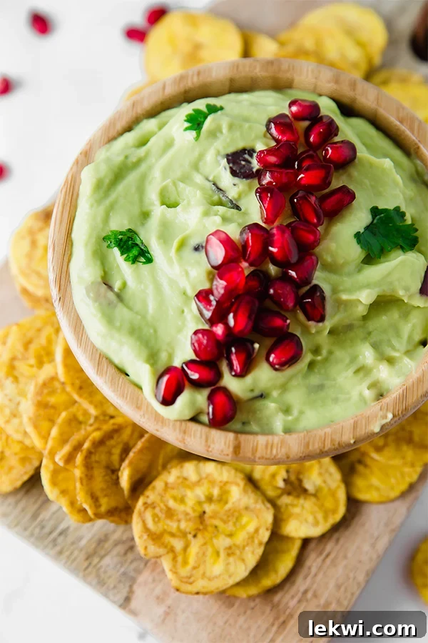 Pomegranate Guacamole, a vibrant and healthy holiday appetizer.