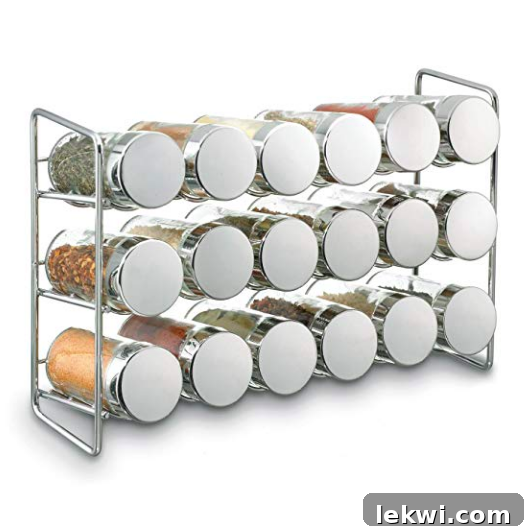 A three-tiered spice rack brimming with neatly labeled spice jars, promoting kitchen organization.