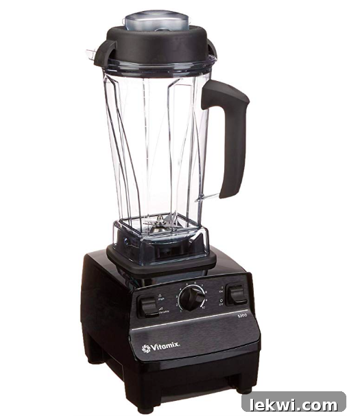 A high-performance Vitamix blender on a kitchen counter, symbolizing blending excellence.