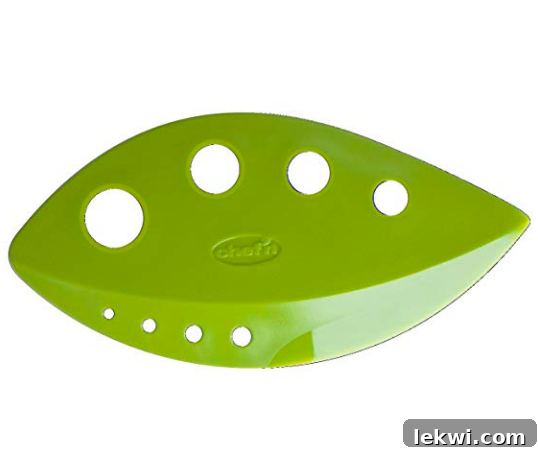 A green kale razor, designed to quickly and easily strip leaves from kale stems, saving prep time.