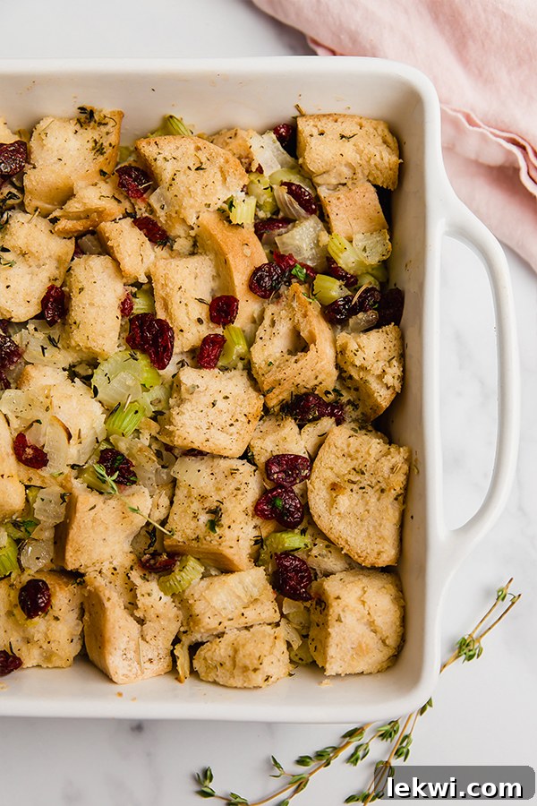 A golden-brown baking dish brimming with delicious gluten-free stuffing, freshly baked and ready for the Thanksgiving table.