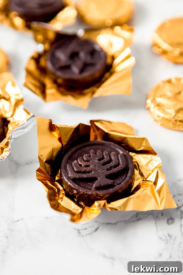 Several pieces of homemade Hanukkah gelt in gold wrappers, ready for celebration.