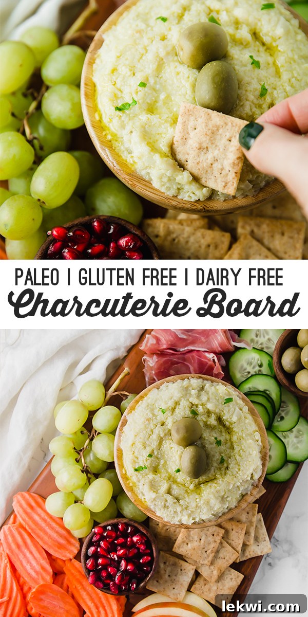 A charcuterie board with hummus, fruit, vegetables, and meats with text reading "paleo gluten free dairy free charcuterie board"