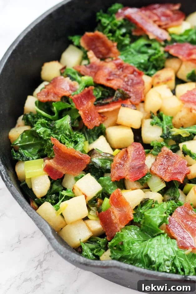 A vibrant bowl of Jicama Breakfast Hash, featuring diced jicama, colorful vegetables, and herbs, perfect for a Paleo, AIP, and Whole30 compliant breakfast.