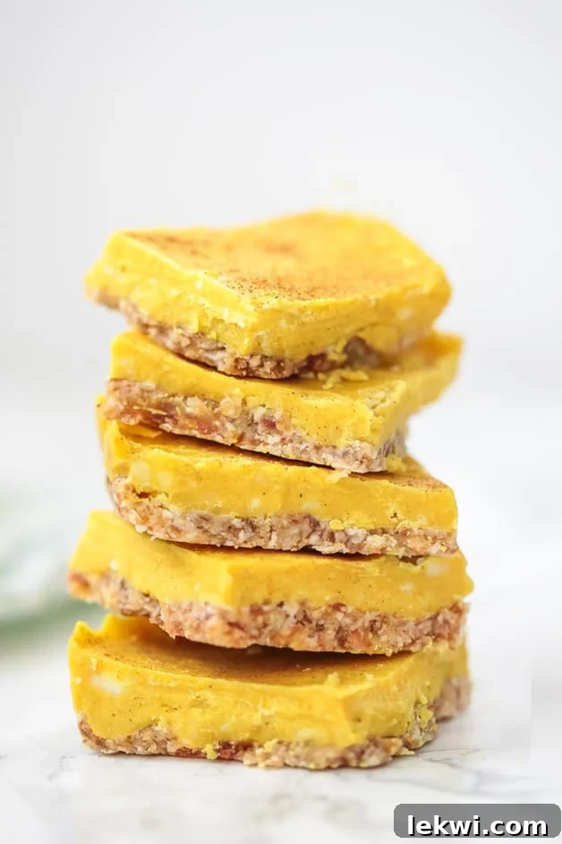 A tempting stack of five vibrant golden turmeric bars, rich in color and texture, arranged artfully.