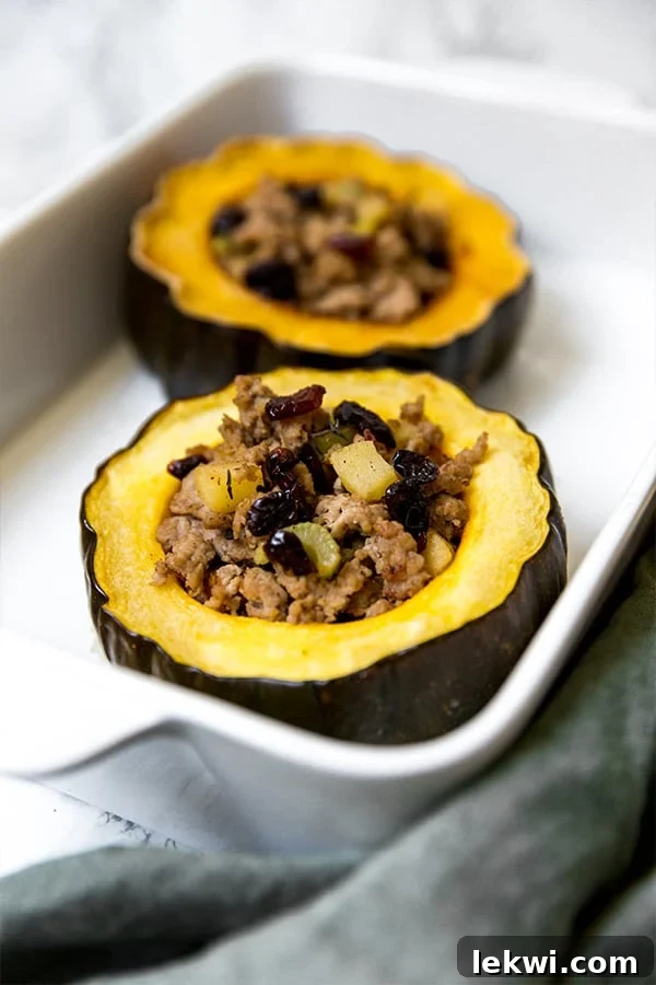 A white ceramic serving dish with two stuffed acorns in it.