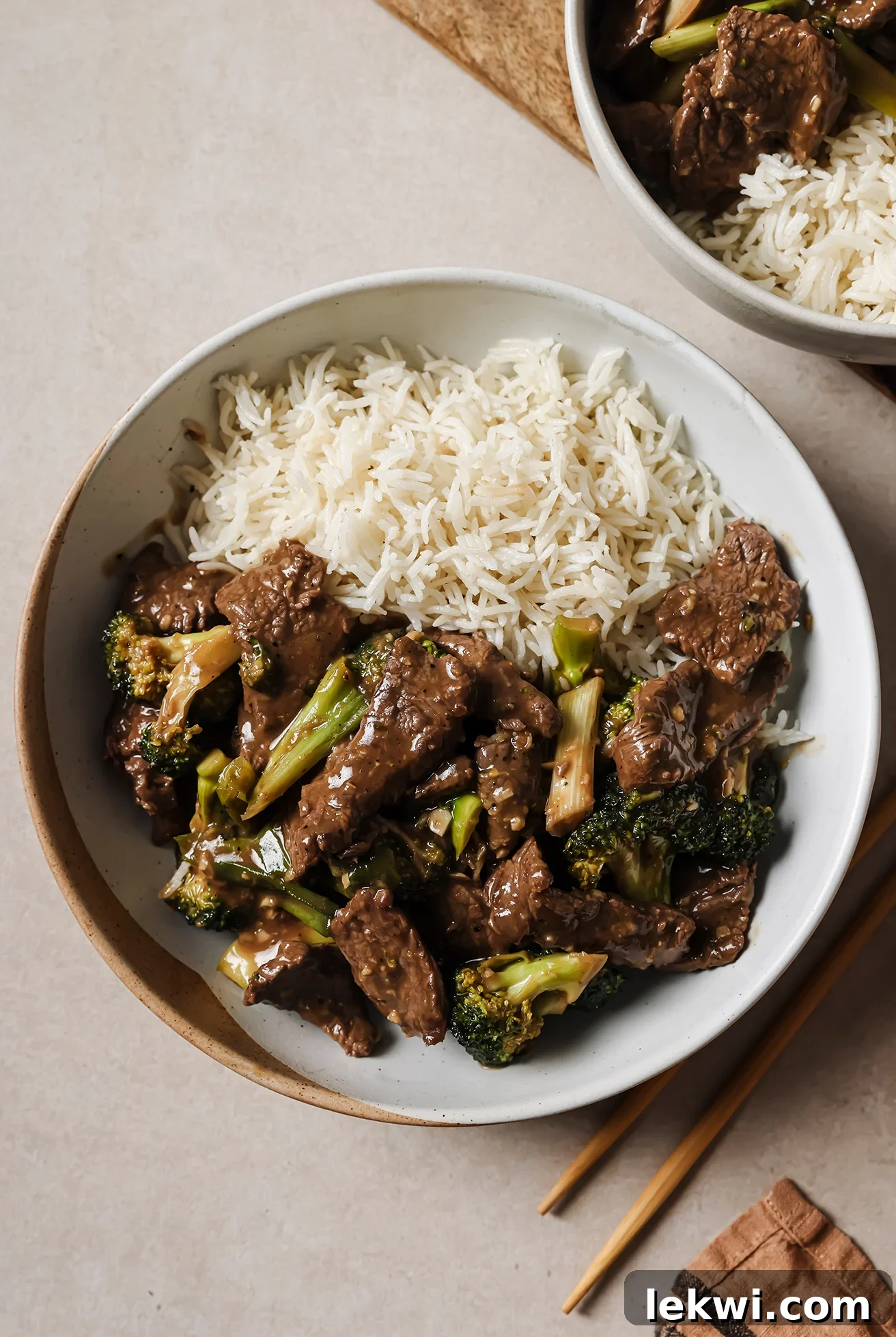 Gluten-free Mongolian beef with broccoli in a bowl, paired with rice and ready to be enjoyed.