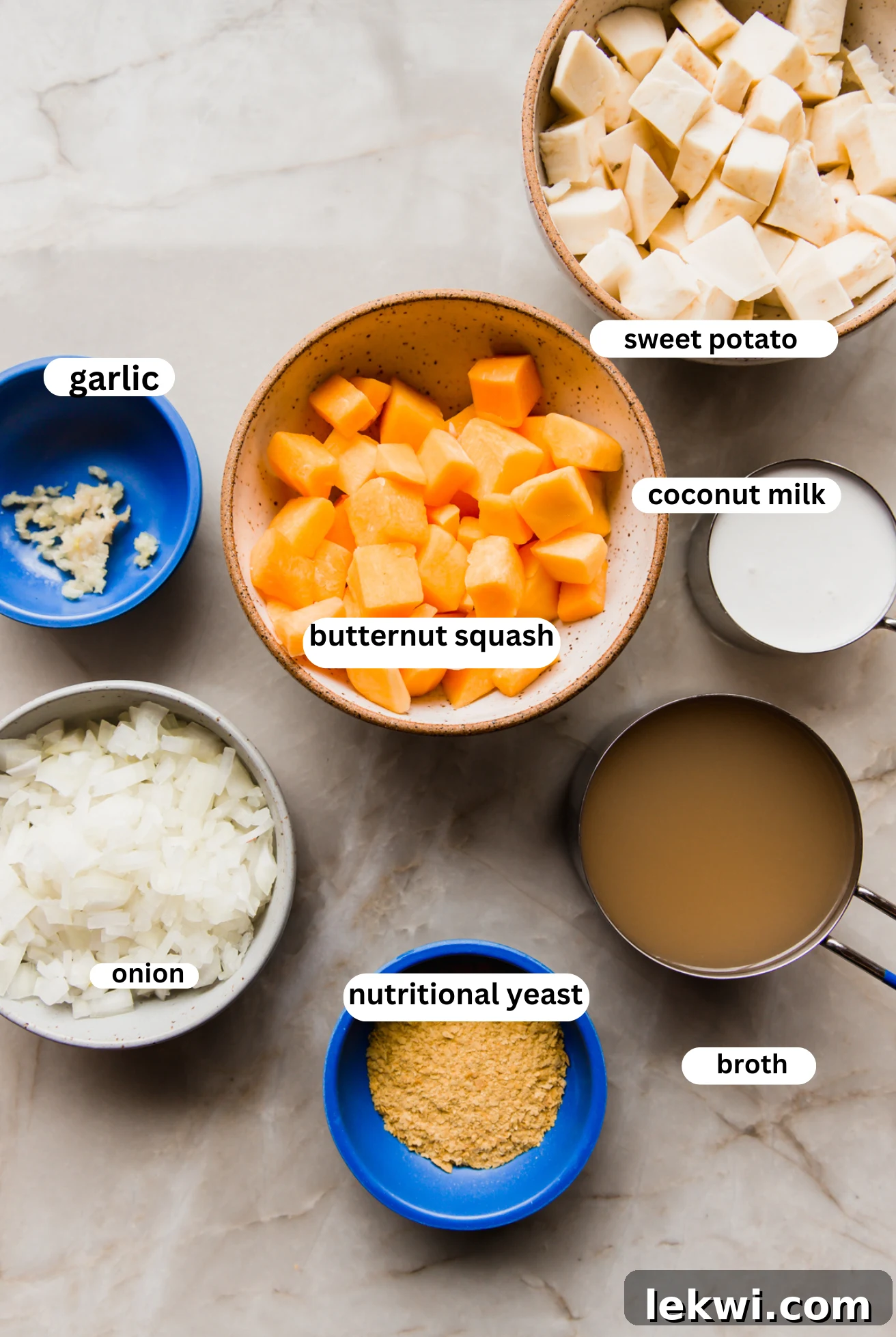 Dairy free queso ingredients laid out in separate bowls, ready for cooking.