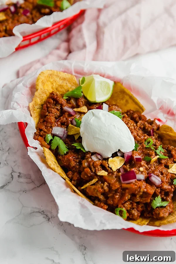 Paleo Frito pie served in a basket, a healthier take on a classic game day dish.